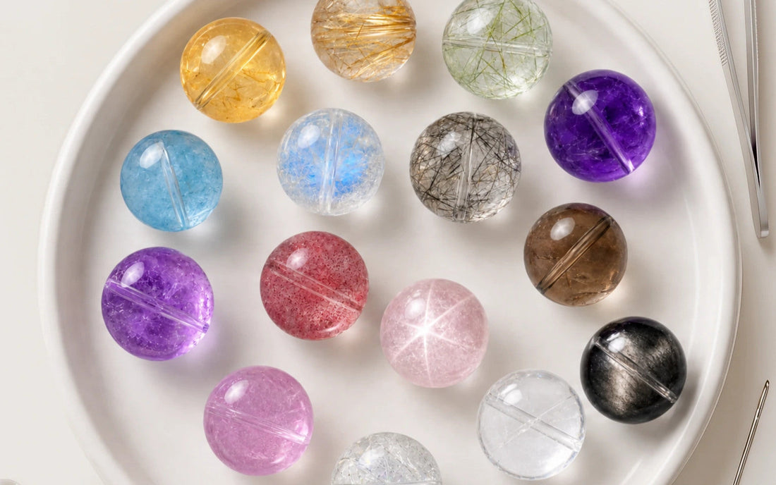 A close view of colorful natural crystal beads in an ivory jewelry design tray